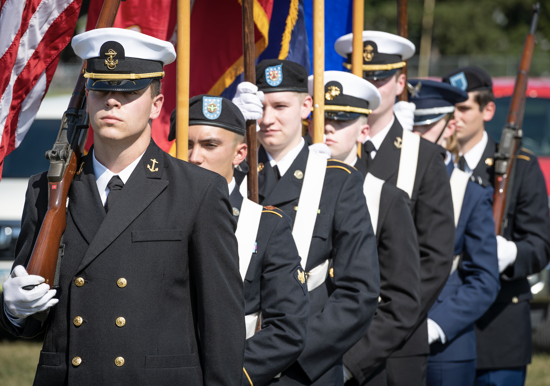 Students holding flags in NROTC